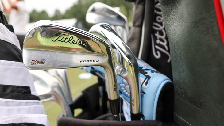 He also has prototype Titleist 718 MB irons in the...