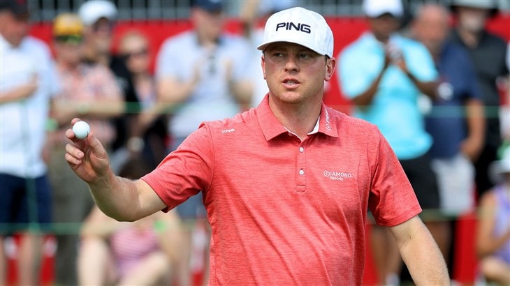 Nate Lashley, winner of the 2019 Rocket Mortgage Classic, raises his Pro V1x golf ball to acknowledge the fans at Detroit Golf Club